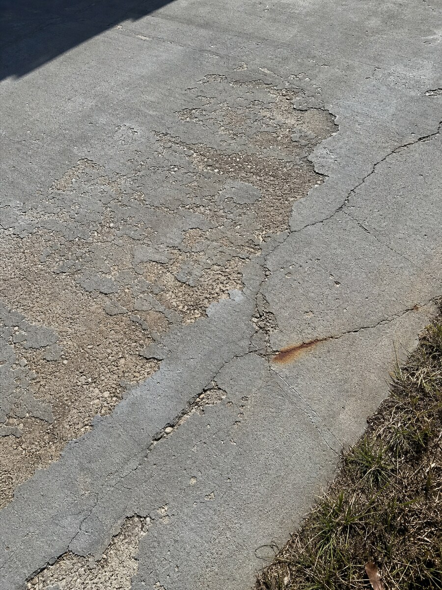Close-up of concrete surface spalling repair planning in Jensen Beach